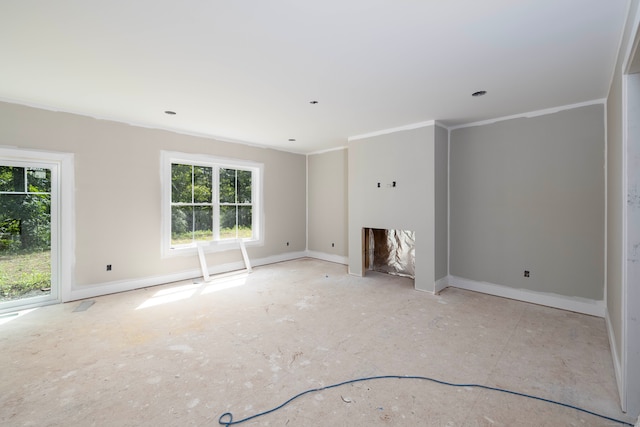 unfurnished living room featuring a fireplace, a healthy amount of sunlight, and crown molding