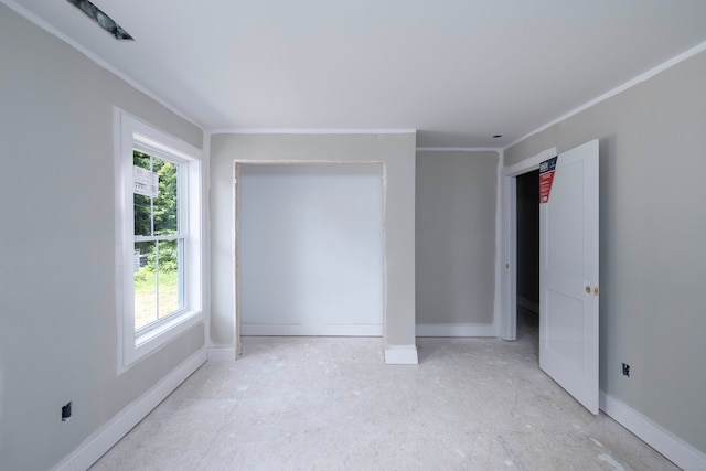 spare room featuring crown molding