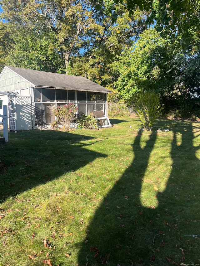 view of yard with a sunroom