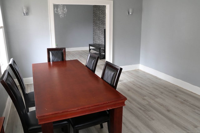 dining space featuring light wood-type flooring