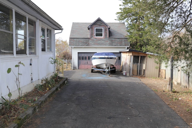 view of side of property with an outbuilding