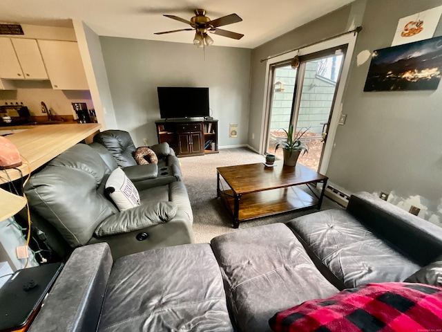 carpeted living room with ceiling fan