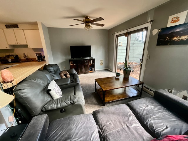 living room with carpet floors and ceiling fan