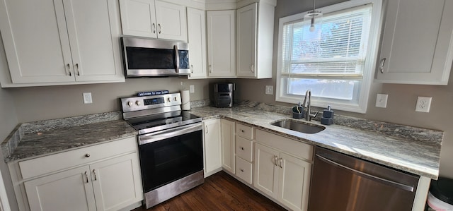 kitchen with white cabinets, sink, and stainless steel appliances