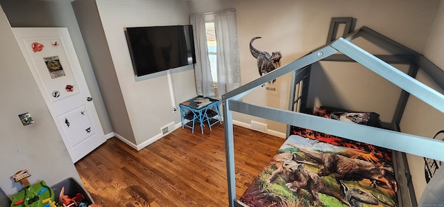 bedroom featuring dark hardwood / wood-style floors