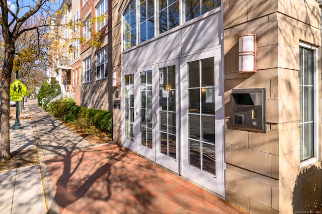 property entrance featuring french doors