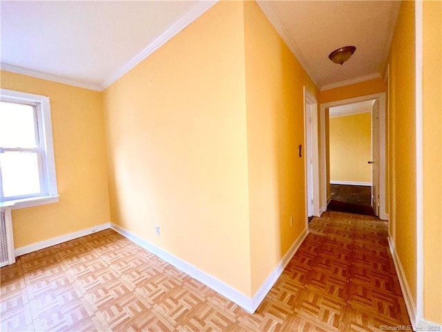 hall with ornamental molding and parquet floors