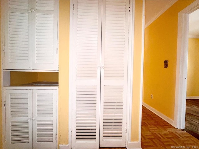 details featuring ornamental molding and parquet flooring