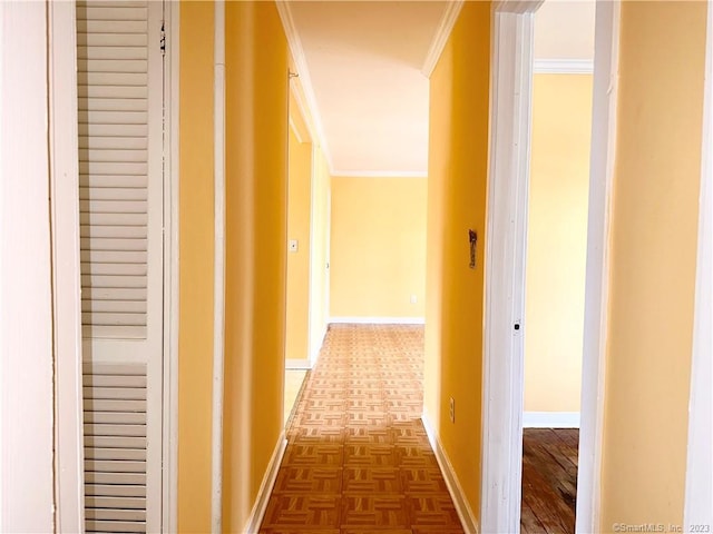 corridor featuring dark parquet floors and crown molding