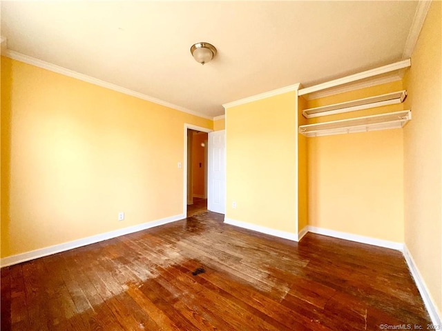 unfurnished bedroom featuring a closet, wood-type flooring, and ornamental molding