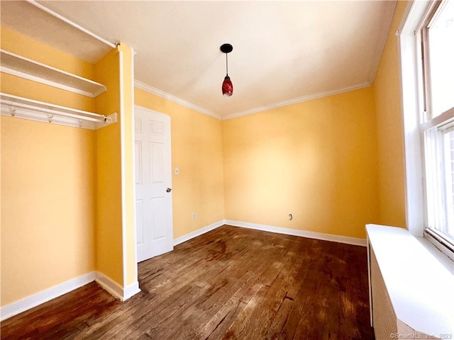 unfurnished bedroom with dark hardwood / wood-style floors and crown molding