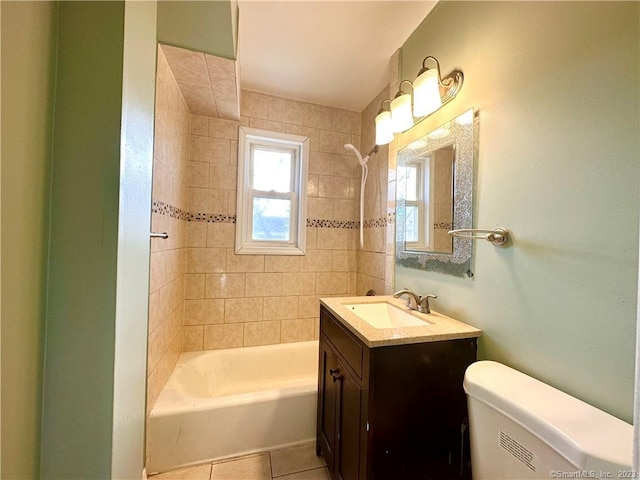 full bathroom with vanity, tile patterned floors, toilet, and tiled shower / bath combo