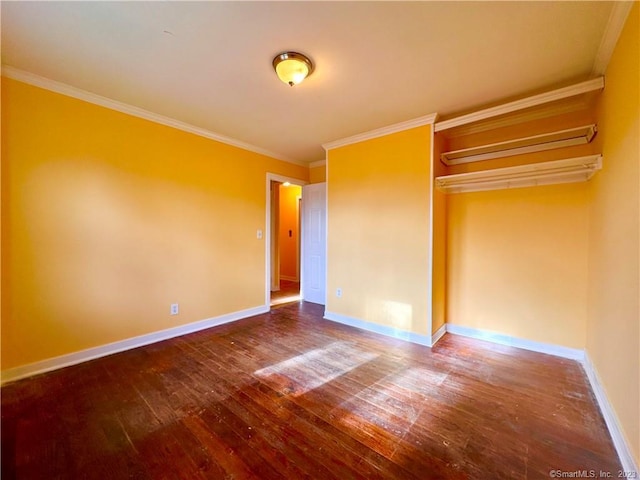 unfurnished bedroom featuring hardwood / wood-style floors, crown molding, and a closet