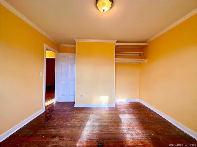 unfurnished bedroom with dark wood-type flooring, a closet, and ornamental molding