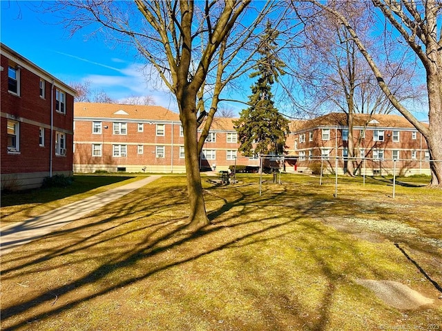 view of home's community featuring a lawn