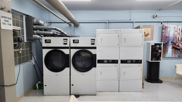 laundry room featuring washing machine and dryer and stacked washer and dryer