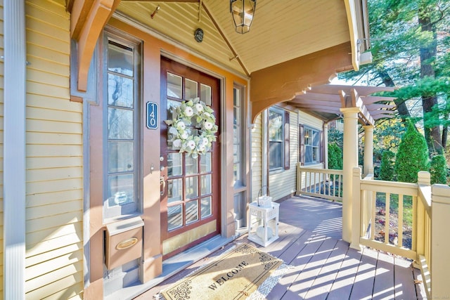 view of exterior entry with covered porch