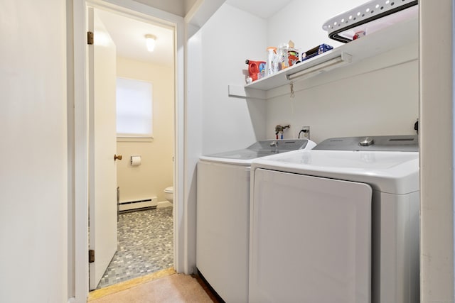 laundry room featuring a baseboard radiator and washing machine and clothes dryer