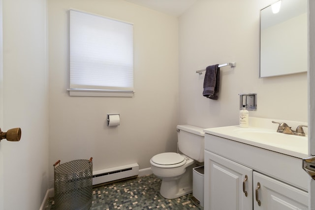 bathroom with vanity, toilet, and a baseboard heating unit