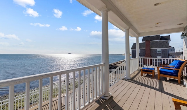 balcony with a view of the beach and a water view