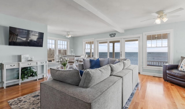 442 Seaside Ave, Westbrook, CT 06498 - living room featuring ceiling fan, light wood finished floors, beamed ceiling, and a water view