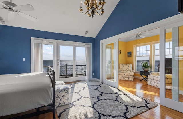 442 Seaside Ave, Westbrook, CT 06498 - bedroom featuring french doors, access to outside, multiple windows, wood finished floors, and high vaulted ceiling