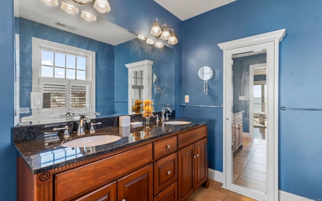 bathroom featuring tile patterned floors and vanity