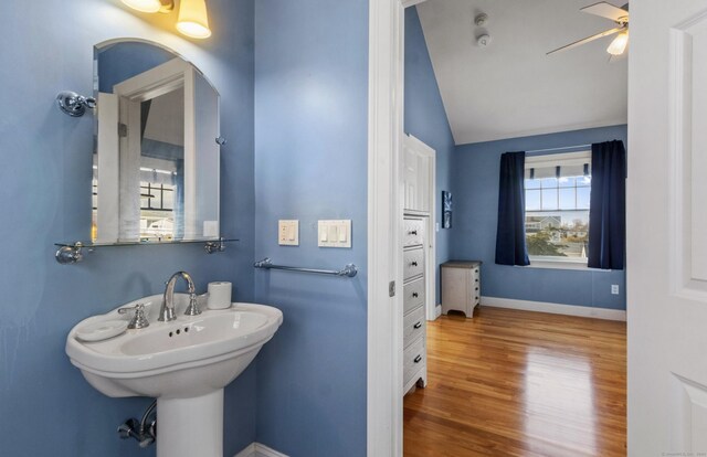 442 Seaside Ave, Westbrook, CT 06498 - bathroom with lofted ceiling, ceiling fan, wood finished floors, baseboards, and a sink