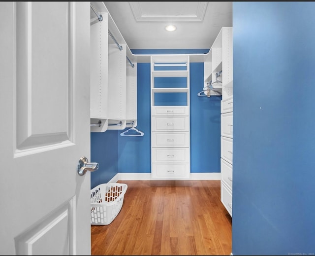 442 Seaside Ave, Westbrook, CT 06498 - walk in closet featuring wood finished floors and attic access