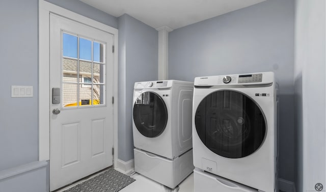 laundry area with independent washer and dryer