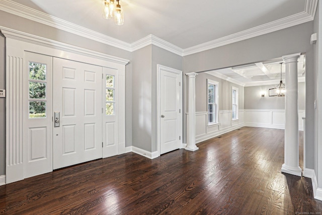 foyer with coffered ceiling, a notable chandelier, dark hardwood / wood-style flooring, crown molding, and beam ceiling