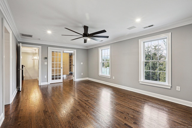 empty room with ceiling fan, dark hardwood / wood-style flooring, and crown molding