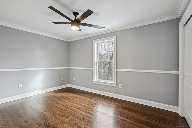 unfurnished room featuring ceiling fan, dark hardwood / wood-style flooring, and ornamental molding