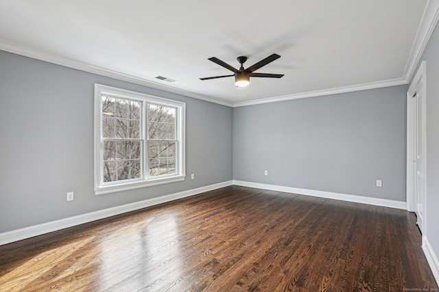 spare room with ceiling fan, dark wood-type flooring, and crown molding