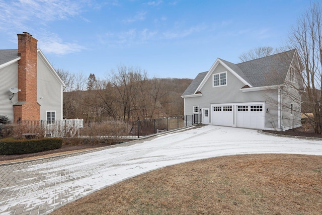 view of side of home featuring a garage