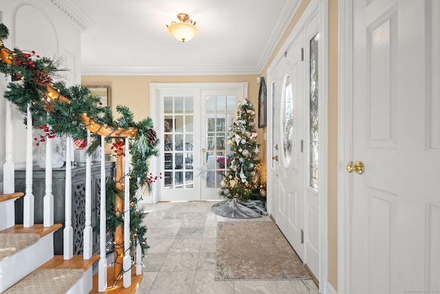 entrance foyer with french doors and crown molding