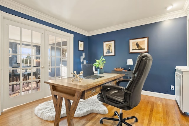 home office with light wood-type flooring, french doors, and crown molding