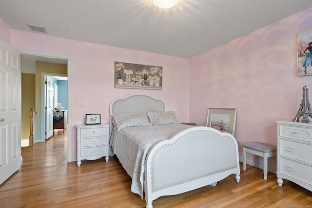 bedroom featuring light wood-type flooring