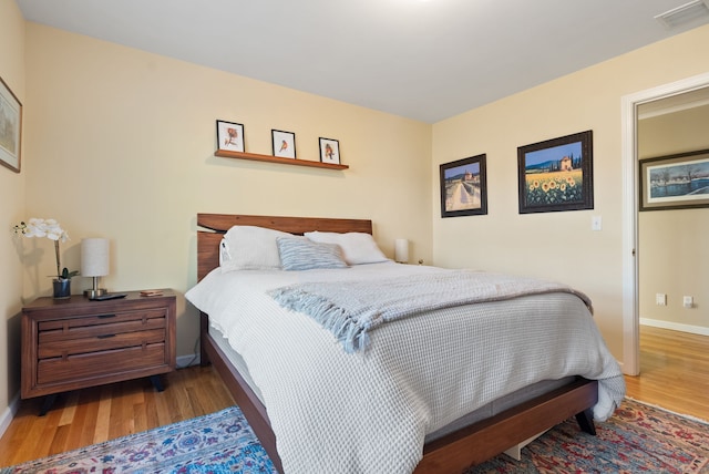 bedroom featuring hardwood / wood-style flooring