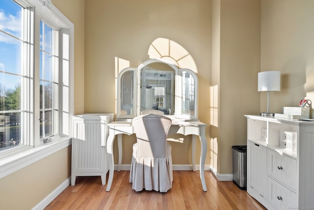 dining area featuring plenty of natural light and light hardwood / wood-style flooring