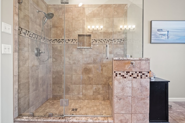 bathroom featuring a shower with door