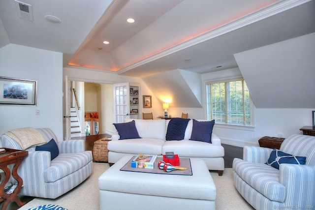 carpeted living room featuring lofted ceiling