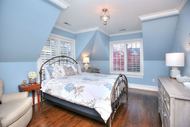 bedroom featuring dark hardwood / wood-style flooring, ornamental molding, and vaulted ceiling