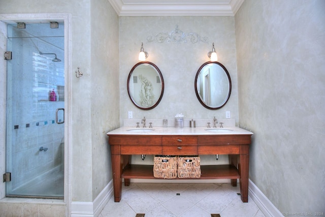 bathroom with vanity, a shower with door, and crown molding