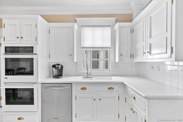 kitchen with backsplash, white cabinetry, white double oven, and dishwasher