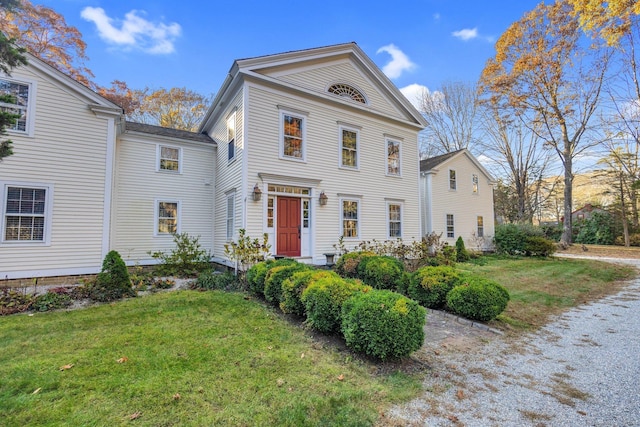 neoclassical / greek revival house with a front yard