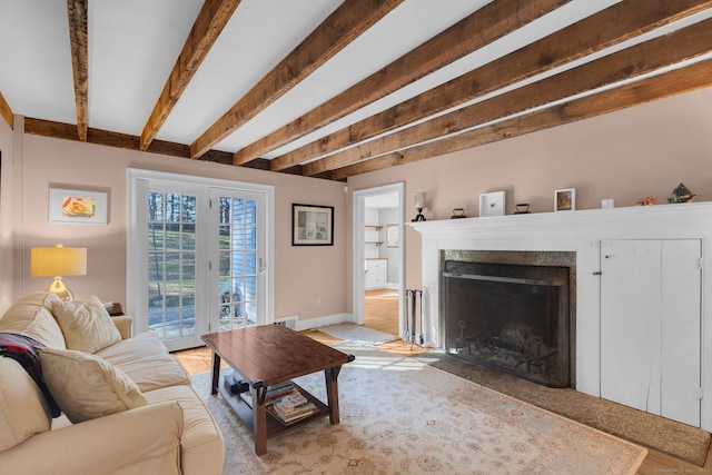 living room featuring beam ceiling