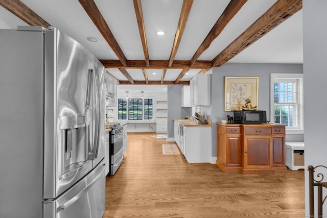 kitchen featuring white cabinetry, plenty of natural light, light hardwood / wood-style flooring, and appliances with stainless steel finishes