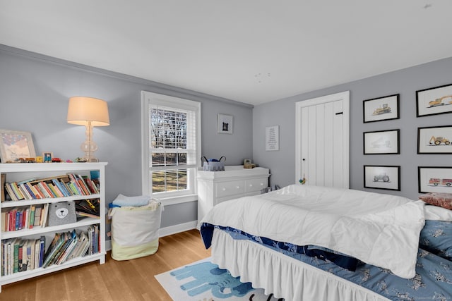 bedroom with light hardwood / wood-style flooring