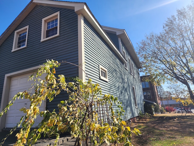 view of side of home with a garage